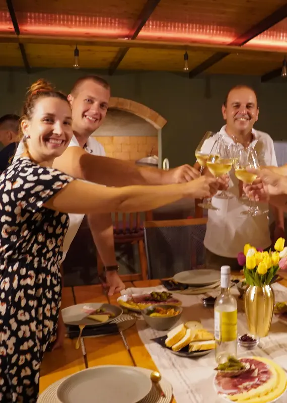 Tour group enjoying local food and wine at the Trek My Day Forest Base in Konavle